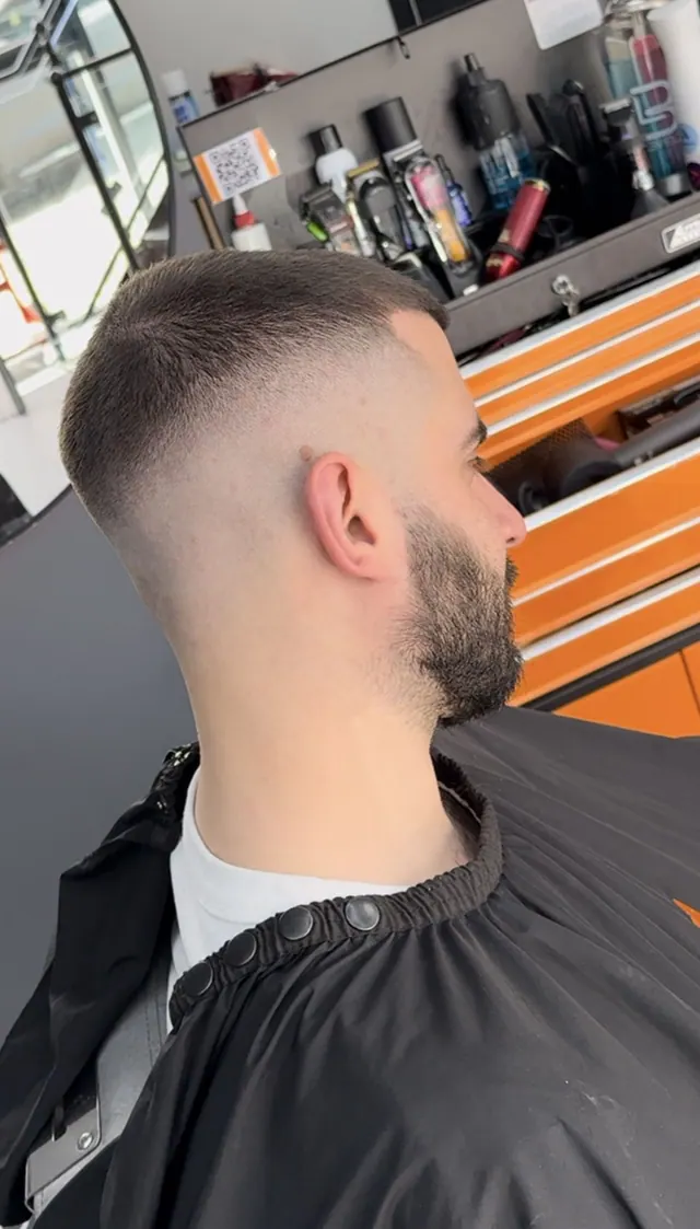 A skin fade with a beard