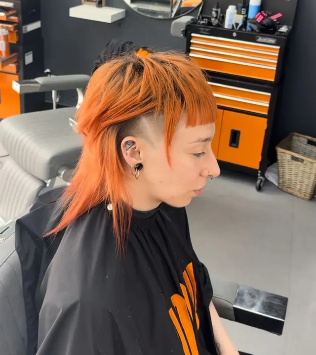 An orange mullet with shaved sides